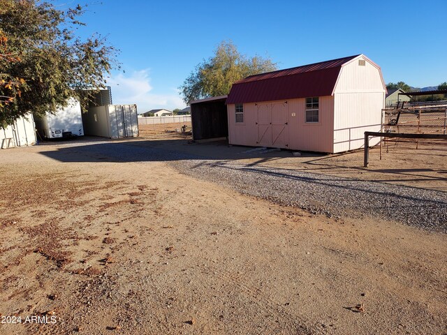 exterior space with a storage shed