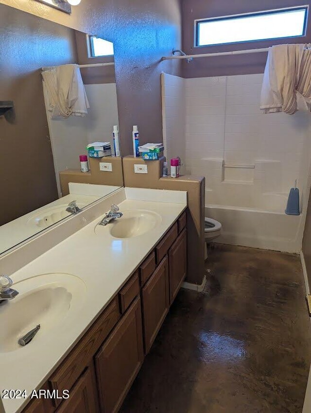 full bathroom featuring shower / washtub combination, toilet, and double vanity