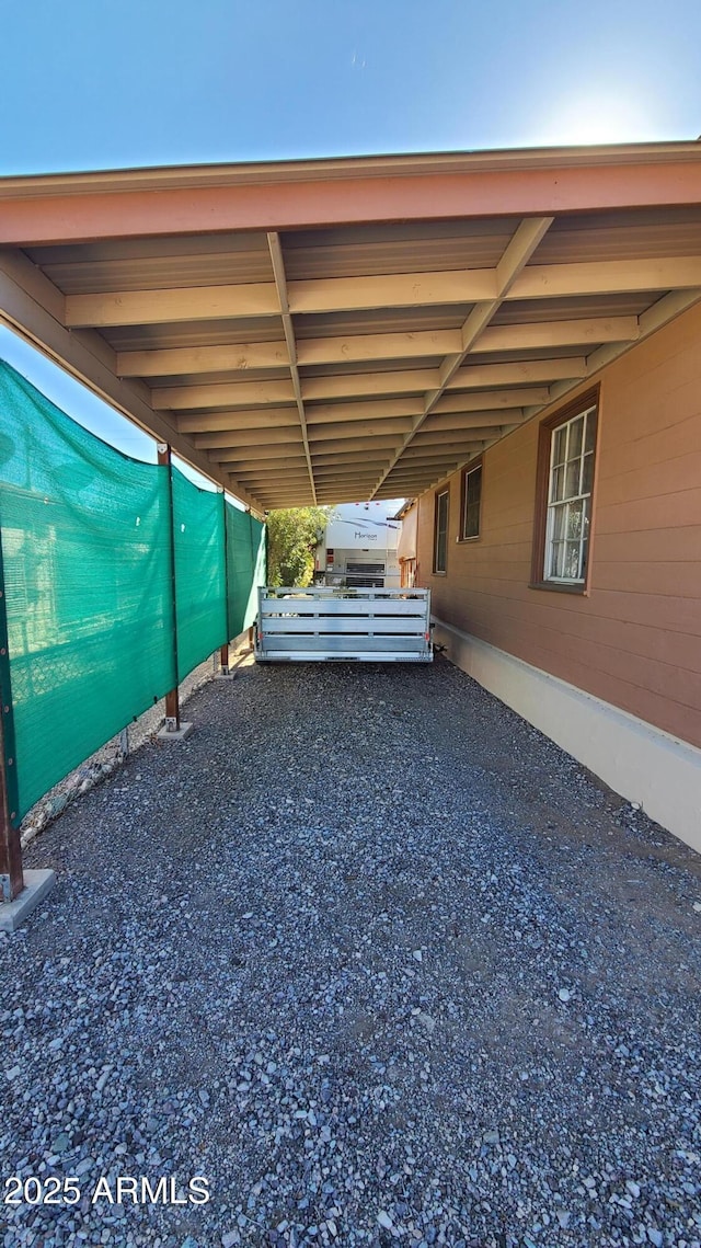 view of vehicle parking featuring a carport