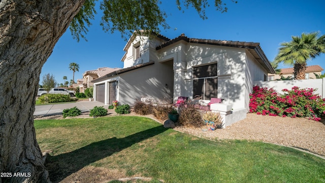 3411 S Vine St, Chandler, AZ 85248 - exterior space featuring a tiled roof, stucco siding, a lawn, an attached garage, and concrete driveway
