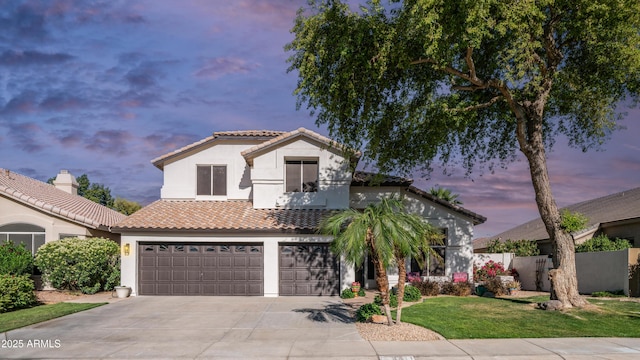 3411 S Vine St, Chandler, AZ 85248 - mediterranean / spanish house with stucco siding, driveway, an attached garage, a tiled roof, and fence