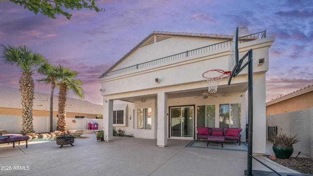 3411 S Vine St, Chandler, AZ 85248 - back of property featuring an outdoor living space with a fire pit, stucco siding, a patio area, fence, and a balcony