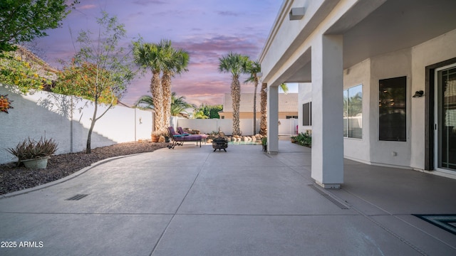 3411 S Vine St, Chandler, AZ 85248 - patio terrace at dusk featuring an outdoor fire pit and a fenced backyard