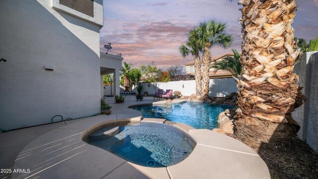 3411 S Vine St, Chandler, AZ 85248 - pool at dusk with a fenced in pool, a patio, an in ground hot tub, and a fenced backyard