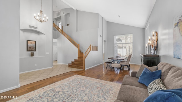 3411 S Vine St, Chandler, AZ 85248 - living area with a chandelier, wood finished floors, visible vents, and stairs