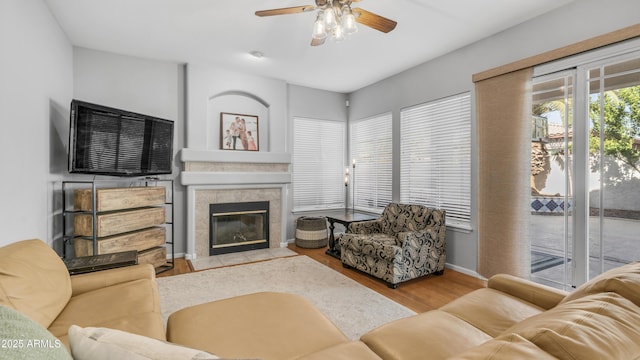 3411 S Vine St, Chandler, AZ 85248 - living room with wood finished floors, a fireplace, a ceiling fan, and baseboards
