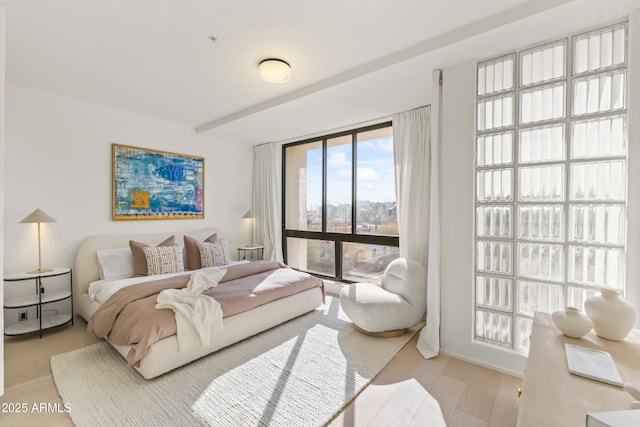 bedroom with light wood finished floors