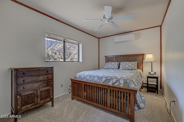 bedroom with a wall mounted AC, carpet floors, crown molding, baseboards, and ceiling fan