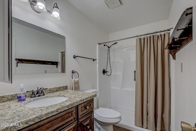 bathroom with a shower with shower curtain, toilet, and vanity