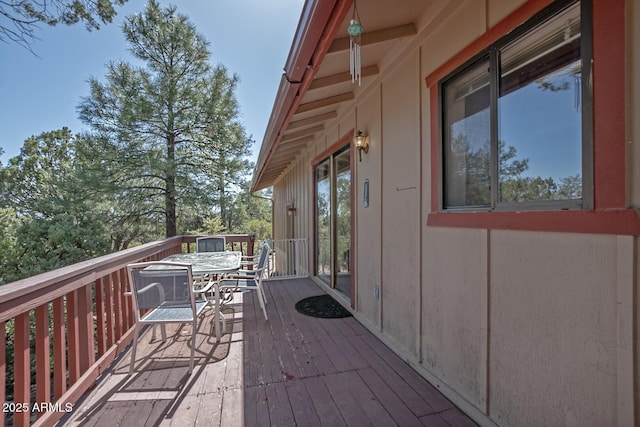 wooden deck with outdoor dining area