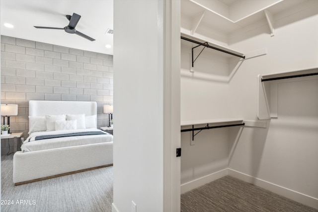 unfurnished bedroom featuring ceiling fan and carpet flooring