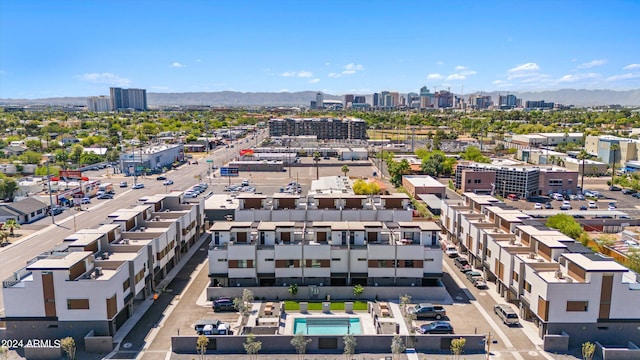 birds eye view of property with a mountain view