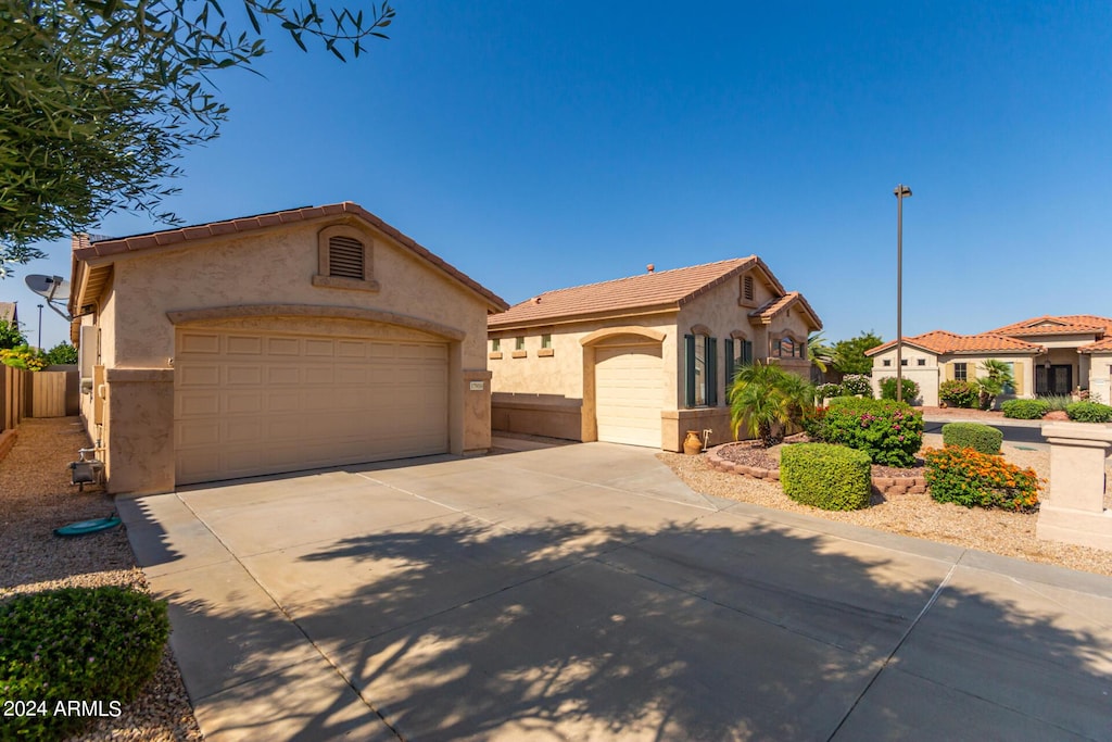 mediterranean / spanish-style house featuring an outbuilding and a garage