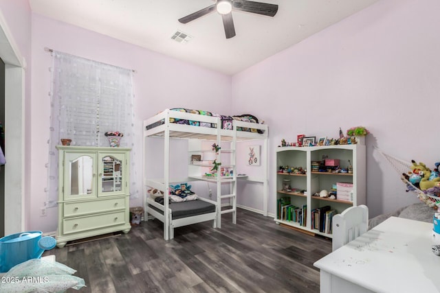 bedroom with visible vents, a ceiling fan, and wood finished floors