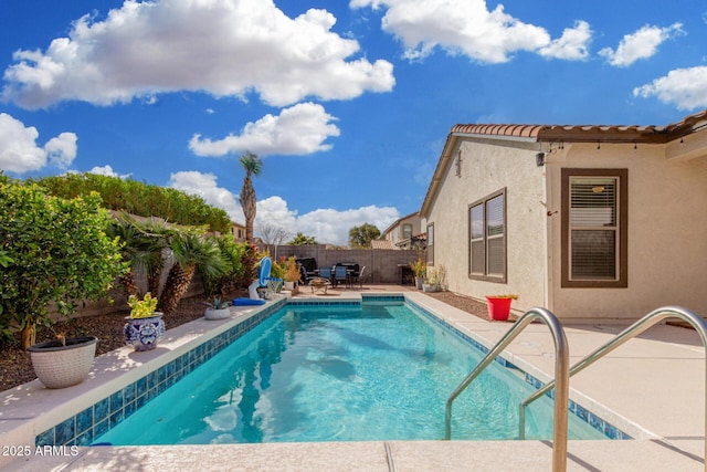 view of pool featuring a patio area, a fenced backyard, and a fenced in pool