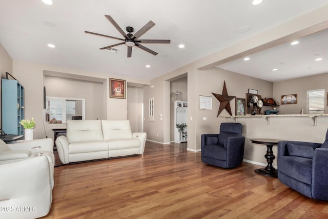 living area featuring recessed lighting, light wood-style flooring, baseboards, and visible vents