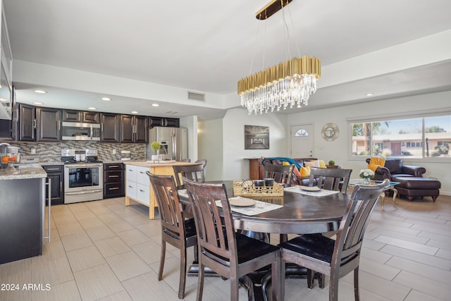 dining space with a notable chandelier