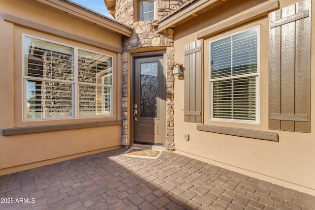 10650 E Palladium Dr, Mesa, AZ 85212 - property entrance featuring stone siding and a patio