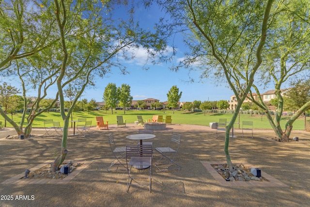10650 E Palladium Dr, Mesa, AZ 85212 - view of home's community featuring an outdoor fire pit and a lawn
