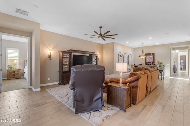 10650 E Palladium Dr, Mesa, AZ 85212 - living area with wood tiled floors, ceiling fan, and recessed lighting