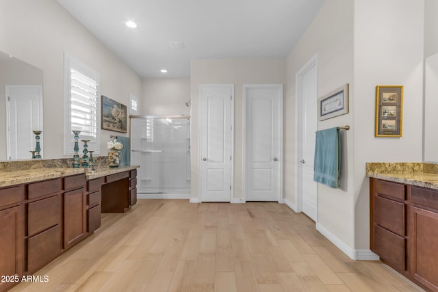 10650 E Palladium Dr, Mesa, AZ 85212 - full bath with a stall shower, vanity, wood finished floors, and recessed lighting