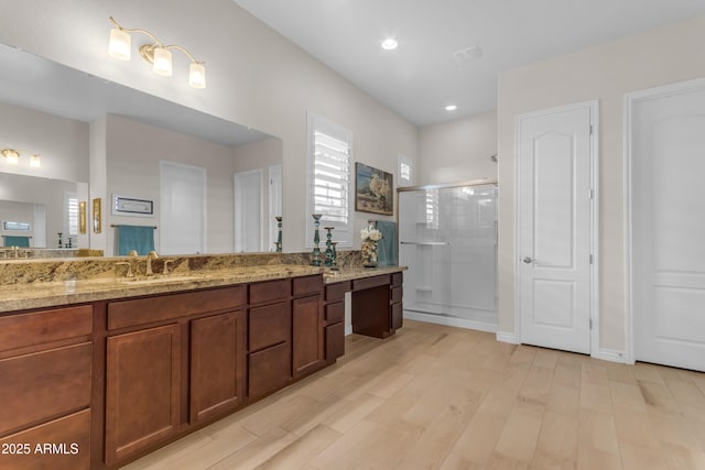 10650 E Palladium Dr, Mesa, AZ 85212 - bathroom with a shower stall, vanity, wood finished floors, and recessed lighting