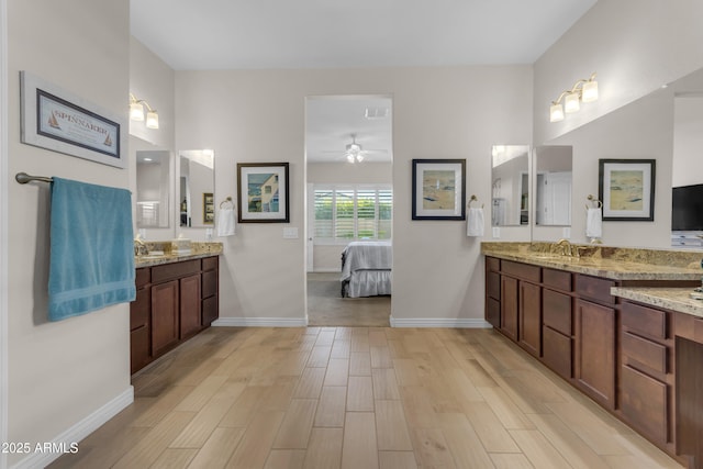 10650 E Palladium Dr, Mesa, AZ 85212 - full bath featuring ensuite bath, wood finished floors, two vanities, and a ceiling fan