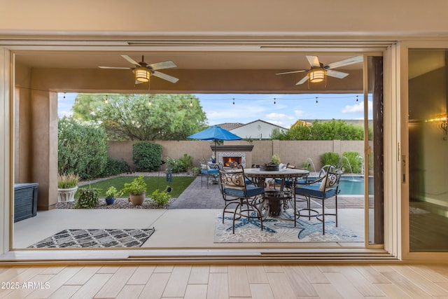 10650 E Palladium Dr, Mesa, AZ 85212 - fenced backyard with a ceiling fan, a patio, and outdoor dining space
