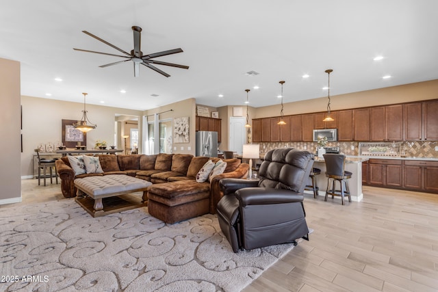 10650 E Palladium Dr, Mesa, AZ 85212 - living room featuring a ceiling fan and recessed lighting