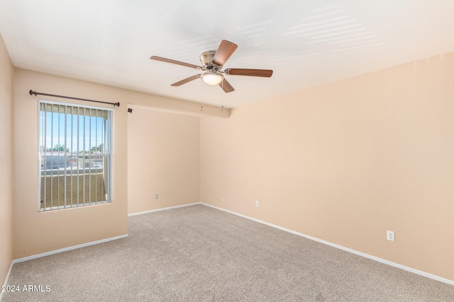 unfurnished room with carpet floors and ceiling fan