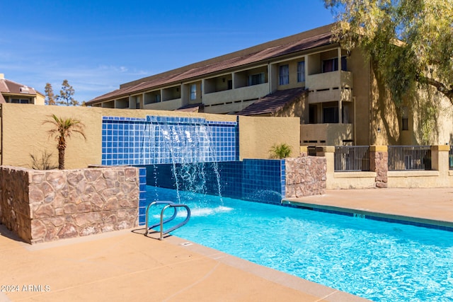 view of pool featuring pool water feature