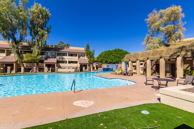 view of pool featuring a patio