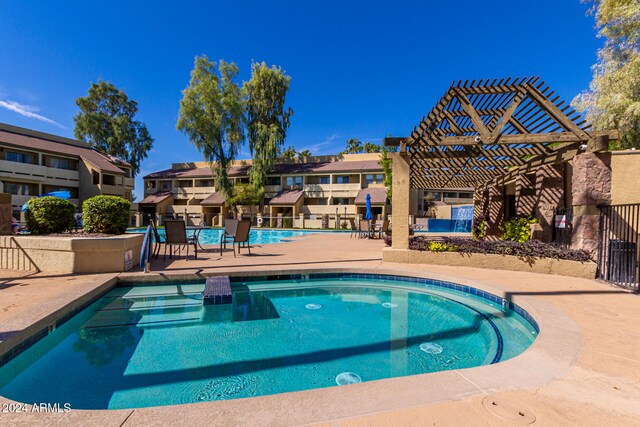 view of pool with a patio area and a pergola