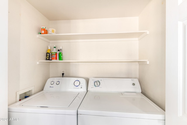 clothes washing area featuring washing machine and clothes dryer