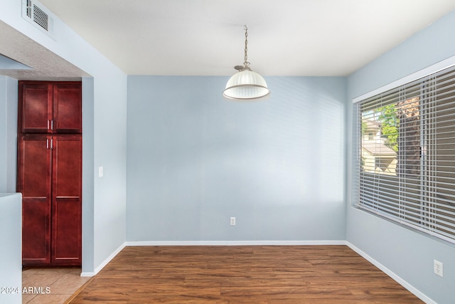 unfurnished room featuring light hardwood / wood-style floors