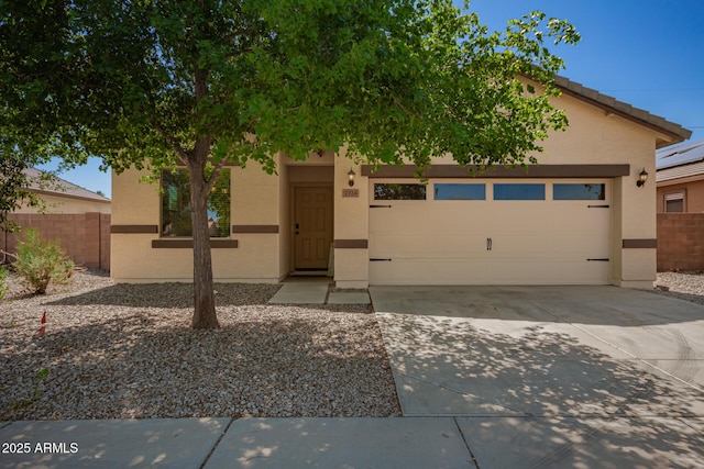 7324 S 254th Dr, Buckeye, AZ 85326 - view of front of home featuring concrete driveway, stucco siding, and an attached garage