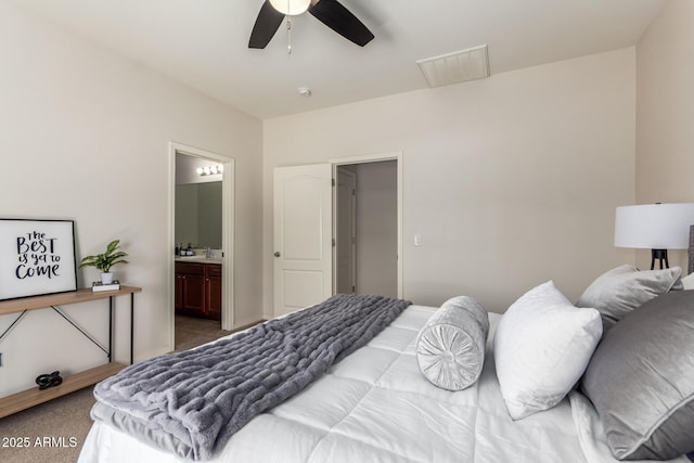 7324 S 254th Dr, Buckeye, AZ 85326 - bedroom featuring ensuite bathroom, a ceiling fan, and carpet flooring