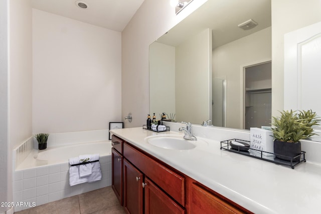 7324 S 254th Dr, Buckeye, AZ 85326 - bathroom featuring vanity, a bath, and tile patterned floors