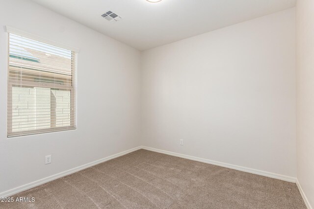 7324 S 254th Dr, Buckeye, AZ 85326 - unfurnished room featuring light carpet and baseboards