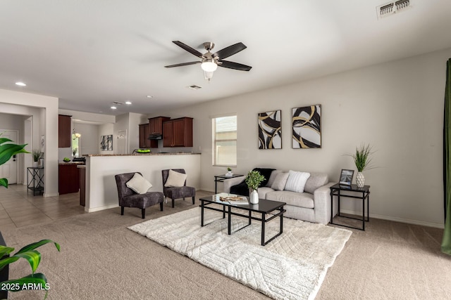 7324 S 254th Dr, Buckeye, AZ 85326 - living room featuring light carpet, ceiling fan, recessed lighting, and baseboards