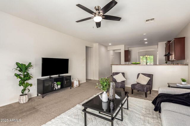 7324 S 254th Dr, Buckeye, AZ 85326 - living area with light carpet, ceiling fan, baseboards, and recessed lighting