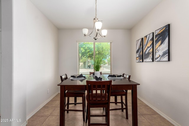 7324 S 254th Dr, Buckeye, AZ 85326 - dining area with light tile patterned floors, a chandelier, and baseboards