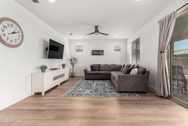 10956 E Thunderbolt Ave, Mesa, AZ 85212 - living room with a ceiling fan, recessed lighting, light wood-type flooring, and baseboards