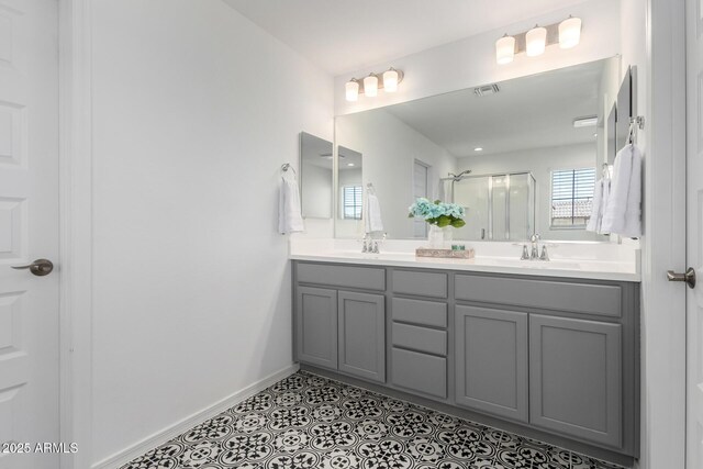 10956 E Thunderbolt Ave, Mesa, AZ 85212 - bathroom with a stall shower, double vanity, and baseboards