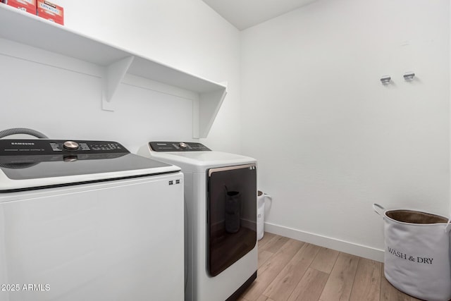 10956 E Thunderbolt Ave, Mesa, AZ 85212 - laundry room with separate washer and dryer, light wood-style flooring, and baseboards