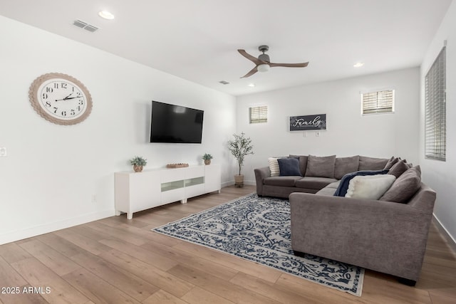 10956 E Thunderbolt Ave, Mesa, AZ 85212 - living area featuring a ceiling fan, wood finished floors, healthy amount of natural light, and recessed lighting