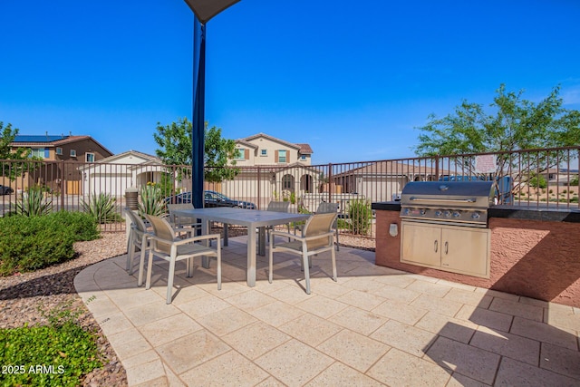 10956 E Thunderbolt Ave, Mesa, AZ 85212 - fenced backyard featuring grilling area, a patio, outdoor dining area, and a residential view