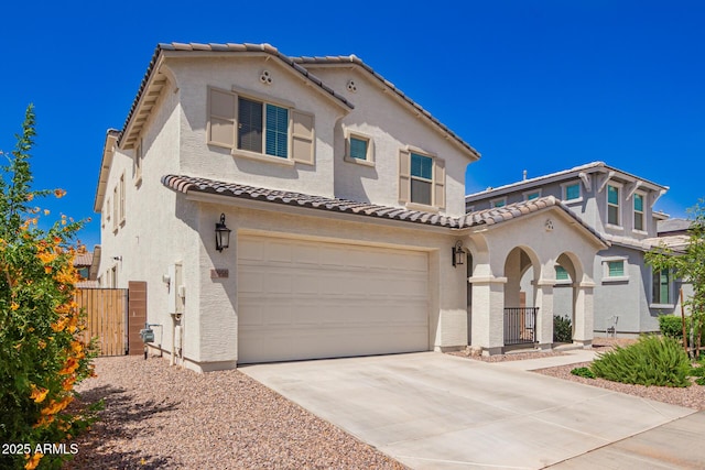 10956 E Thunderbolt Ave, Mesa, AZ 85212 - mediterranean / spanish home with a tile roof, stucco siding, a garage, and driveway