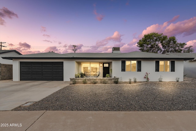 8341 E Hubbell St, Scottsdale, AZ 85257 - ranch-style home featuring an attached garage, driveway, and stucco siding
