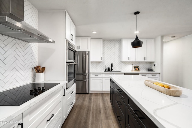 8341 E Hubbell St, Scottsdale, AZ 85257 - kitchen featuring wall chimney exhaust hood, stainless steel appliances, white cabinetry, a sink, and dark cabinetry